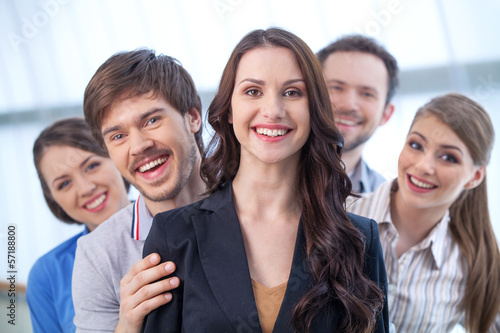 Young woman is leading a group of people.