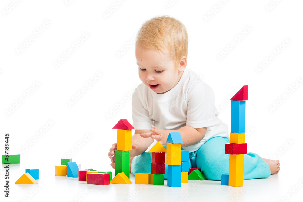 child playing with block toys over white background child playing with block toys over white background