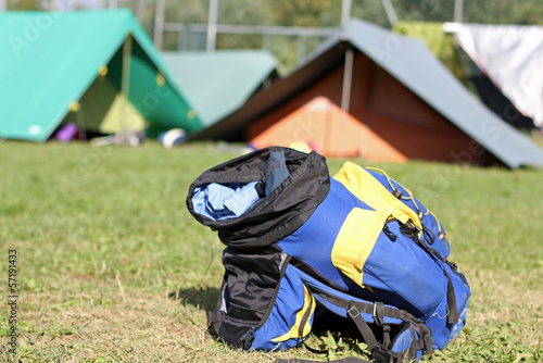 backpack amid the tents of camp during the adventurous excursion