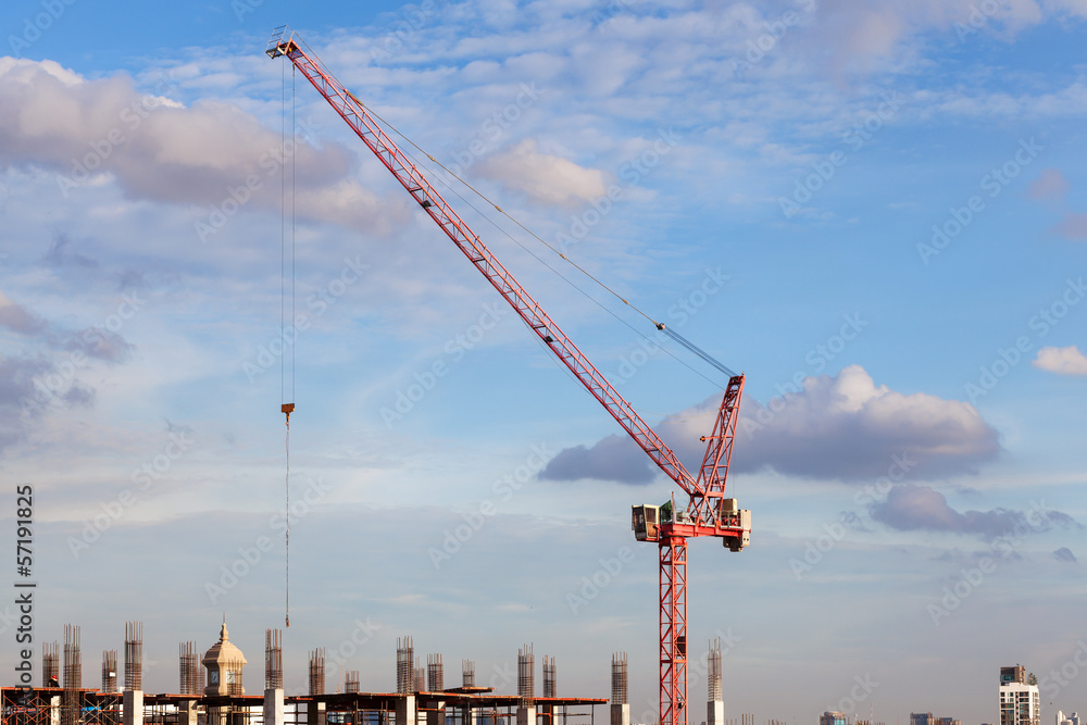 construction site with crane worker and building