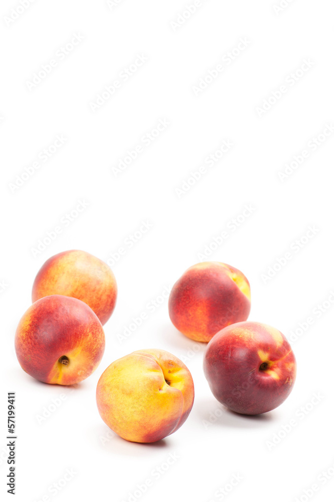 Ripe peaches fruits isolated on white