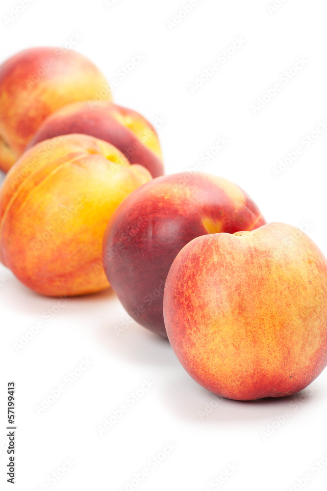 Ripe peaches fruits isolated on white