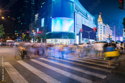Photography night scenery of the city, crossing at night, burred crowd
