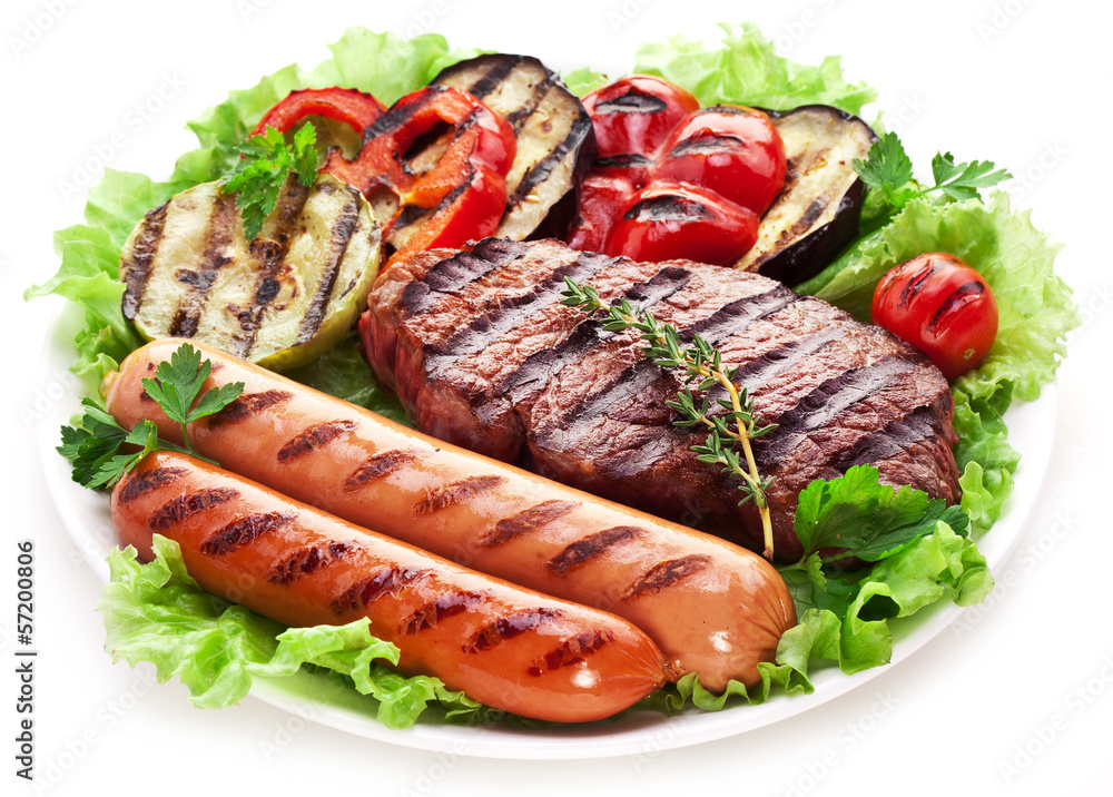 Grilled steak,sausages and vegetables.