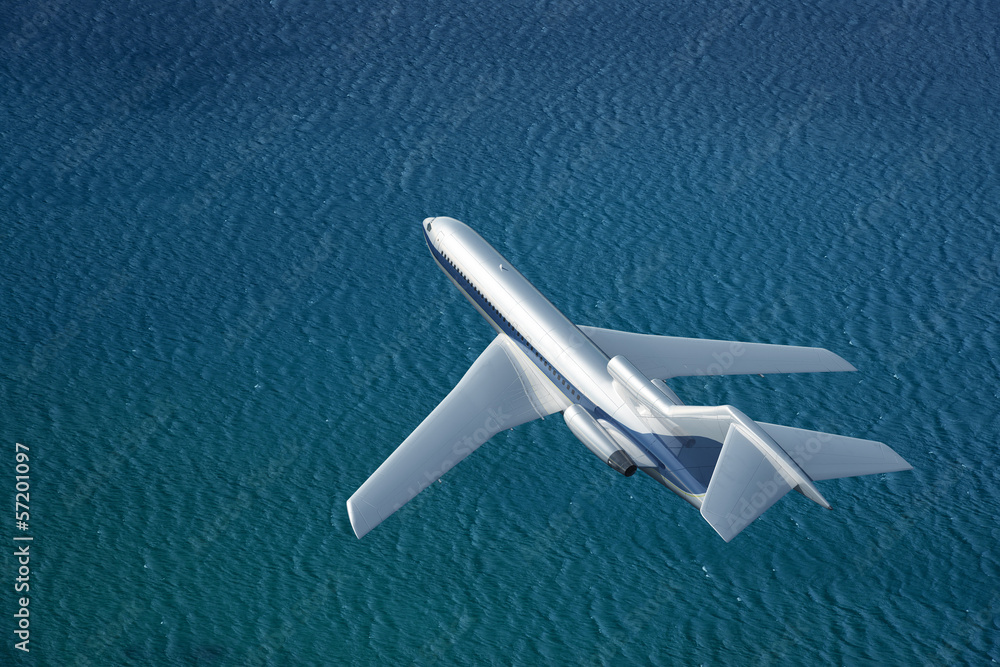 Fototapeta premium airplane flies over a sea