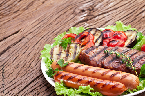 Grilled steak,sausages and vegetables.