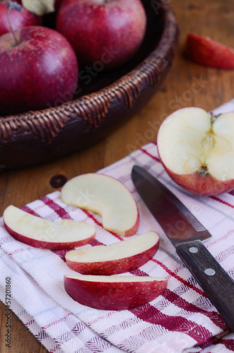 Cutting red ripe apple