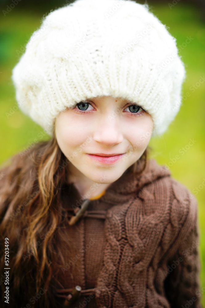 Child girl in white cap, close-up portrait Child girl in white cap, close-up portrait