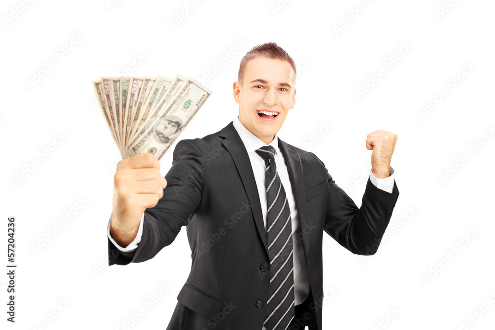 Excited man in black suit holding dollars and gesturing happines Excited man in black suit holding dollars and gesturing happines