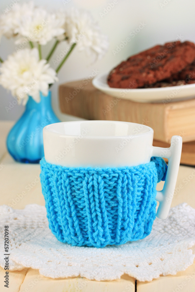 Cup with knitted thing on it close up