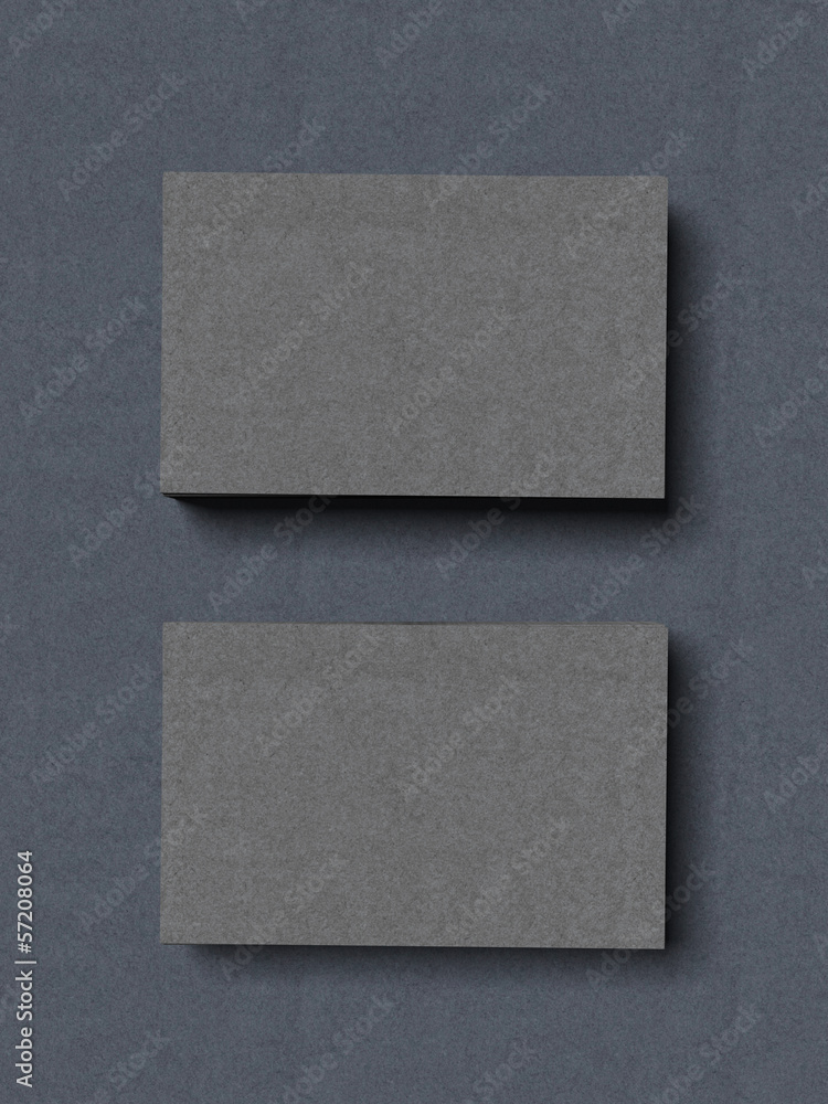 two stacks of grey business cards two stacks of grey business cards