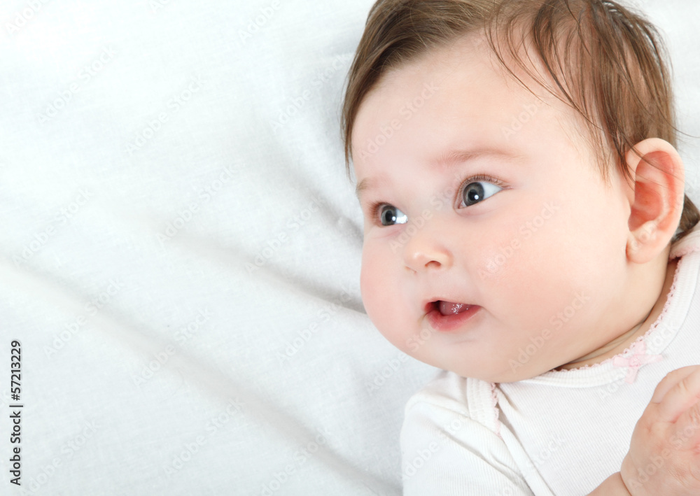 cute funny infant smiling, beautiful kid's portrait closeup