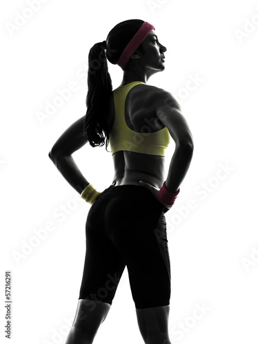 woman exercising fitness workout  standing silhouette rear view © snaptitude