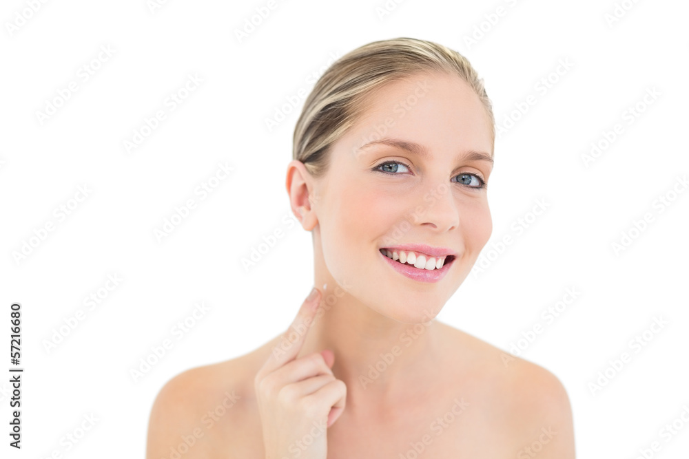 Pleased fresh blonde woman pointing her neck with her finger Pleased fresh blonde woman pointing her neck with her finger