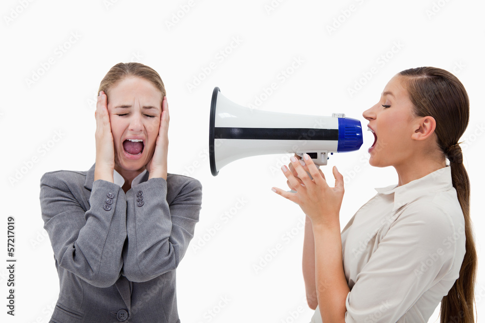 Manager yelling at her colleague through a megaphone Manager yelling at her colleague through a megaphone
