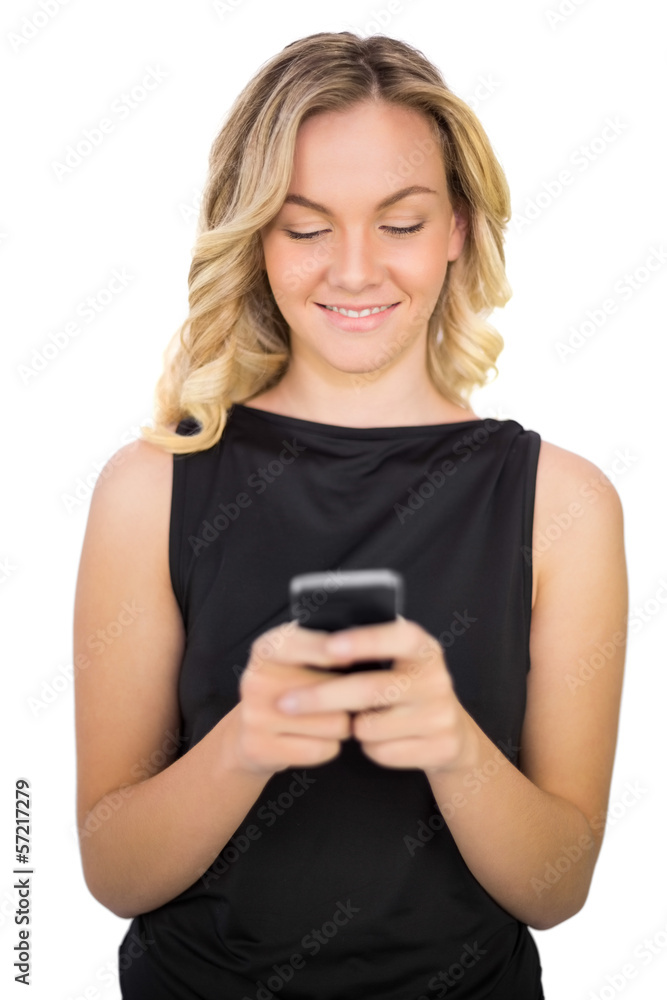 Cheerful gorgeous blonde in black dress texting Cheerful gorgeous blonde in black dress texting