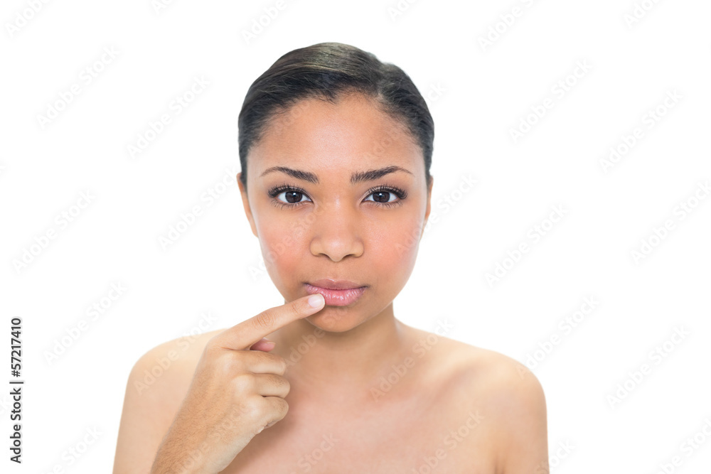 Peaceful young dark haired model touching her lip Peaceful young dark haired model touching her lip