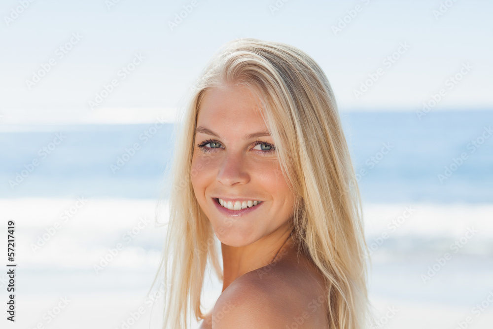 Close up view of blond woman smiling at camera Close up view of blond woman smiling at camera