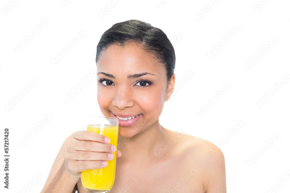 Happy young dark haired model drinking orange juice Happy young dark haired model drinking orange juice