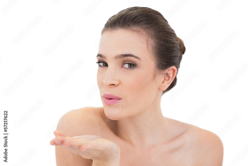 Seductive natural brown haired model blowing a kiss to the camer Seductive natural brown haired model blowing a kiss to the camer