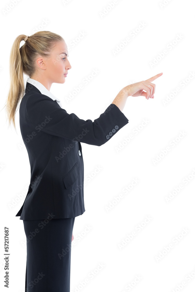 Profile view of attractive blonde businesswoman pointing Profile view of attractive blonde businesswoman pointing