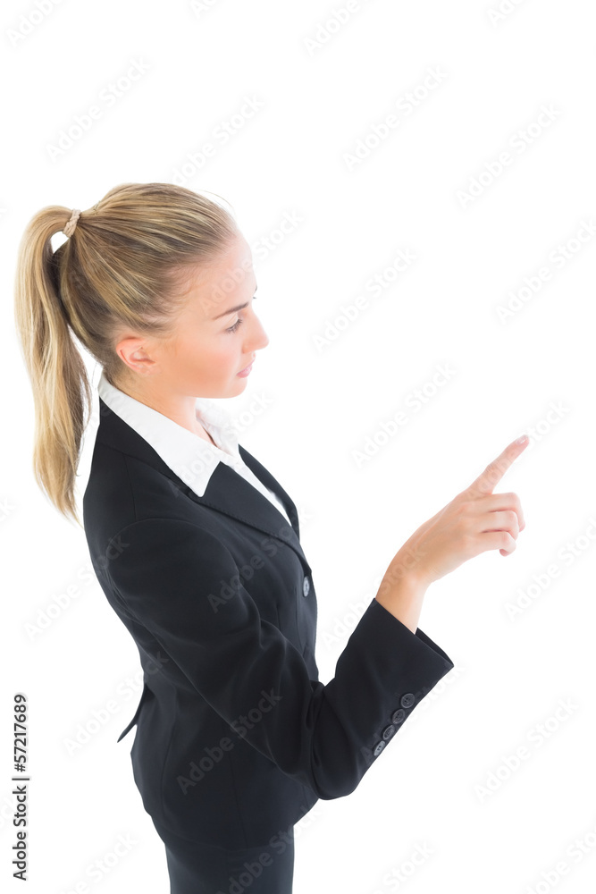 Blonde ponytailed business woman pointing Blonde ponytailed business woman pointing