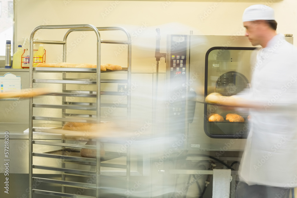 Two bakers working in the kitchen Two bakers working in the kitchen
