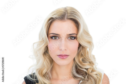 Content blonde model looking at camera