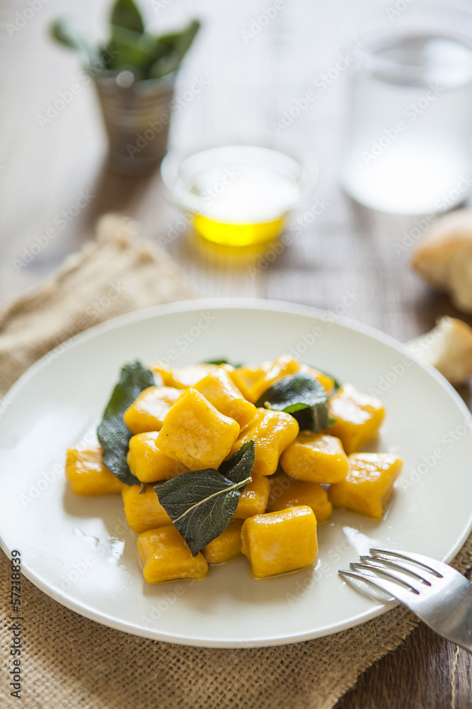 delicious pumpkin gnocchi with sage leaves and olive oil, vegan delicious pumpkin gnocchi with sage leaves and olive oil, vegan