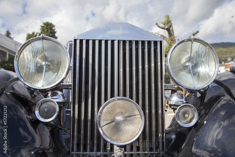 Vintage car details lights and grille, close-up, selective focus