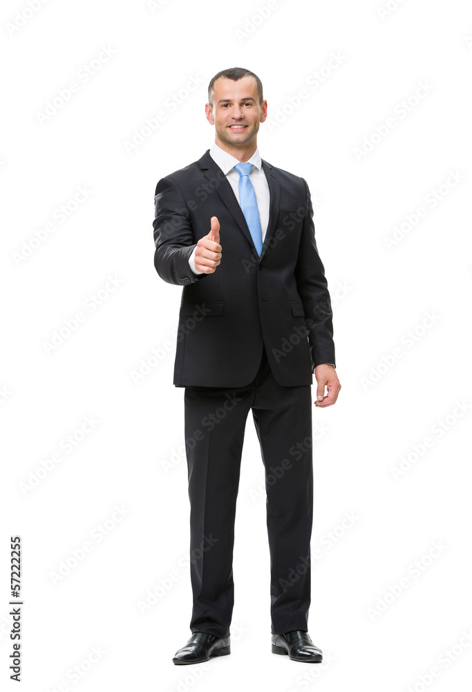 Full-length portrait of businessman who thumbs up Full-length portrait of businessman who thumbs up