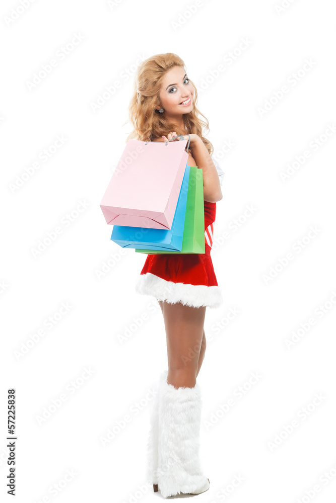 Smiling christmas woman with colorful package Smiling christmas woman with colorful package