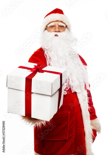 Santa Claus presenting gift box isolated on white background