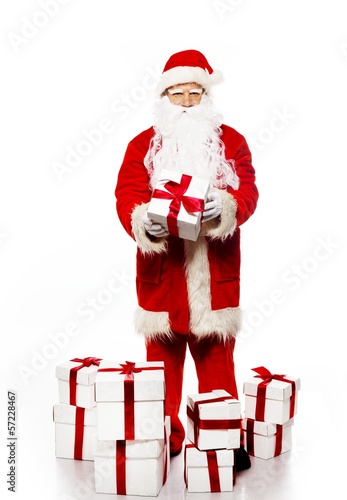 Santa Claus with gift boxes isolated on white background