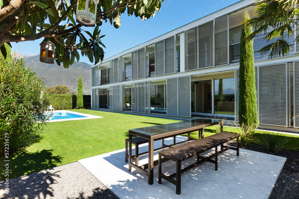 Modern house with pool, view from the garden - obrazy, fototapety, plakaty 