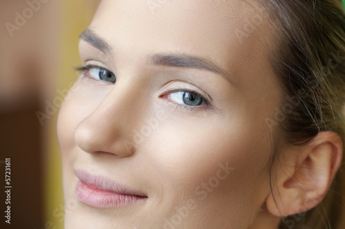 Cheerful beautiful woman without makeup   backstage