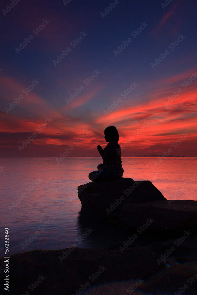 Silhouette yoga girl by the beach  sunset