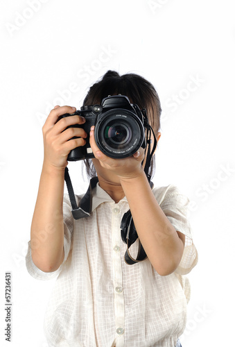 Portrait of asian little girl holding photo camera isolated