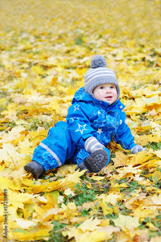 lovely baby age of 1 year outdoors in autumn park
