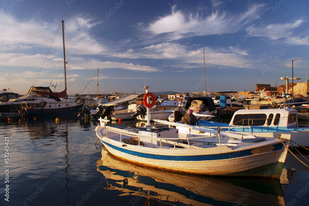 Ships and boats in the old harbor of Chania, Greece.