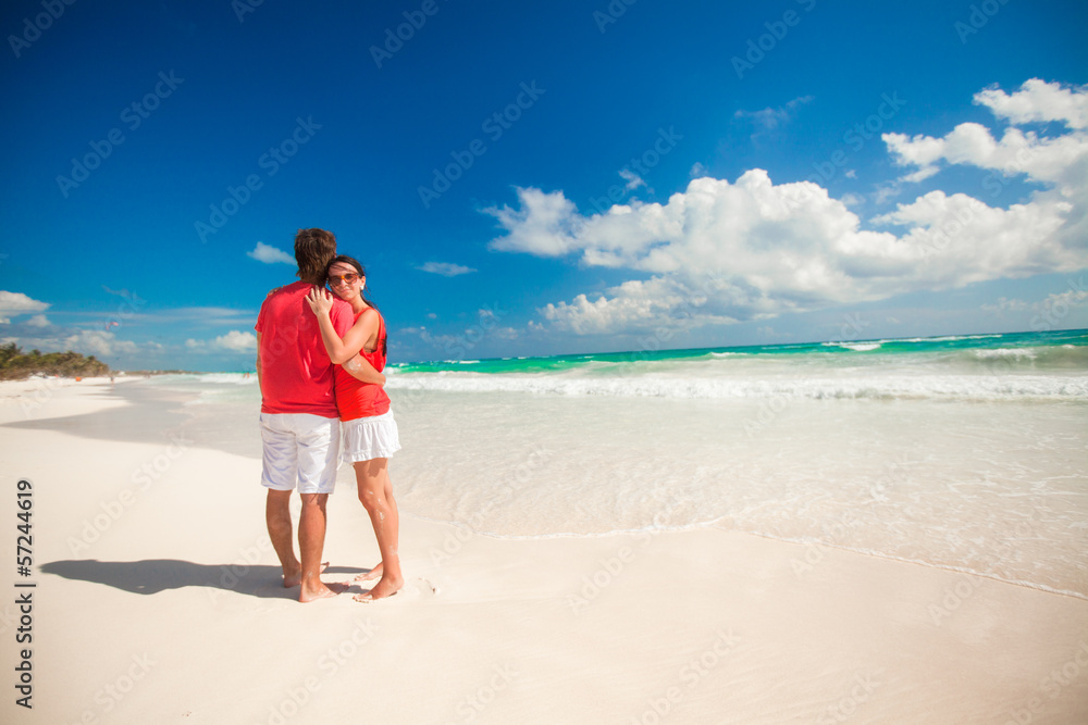 Young couple enjoying each other on a tropical beach Young couple enjoying each other on a tropical beach