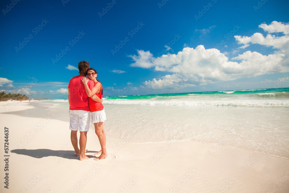 Young couple enjoying each other on a tropical beach Young couple enjoying each other on a tropical beach