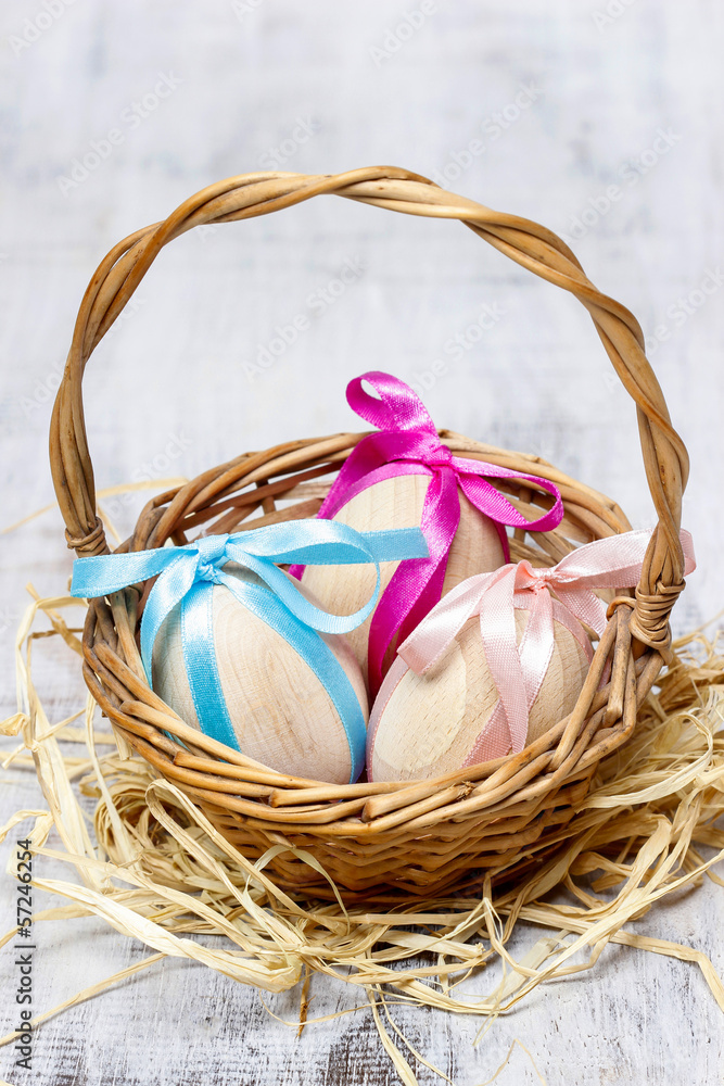 Easter wicker basket of eggs on grey background. Copy space Easter wicker basket of eggs on grey background. Copy space