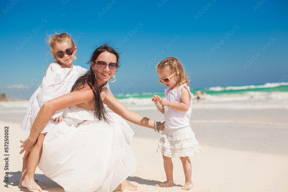 Two wonderful girls having fun with their charming young mother Two wonderful girls having fun with their charming young mother