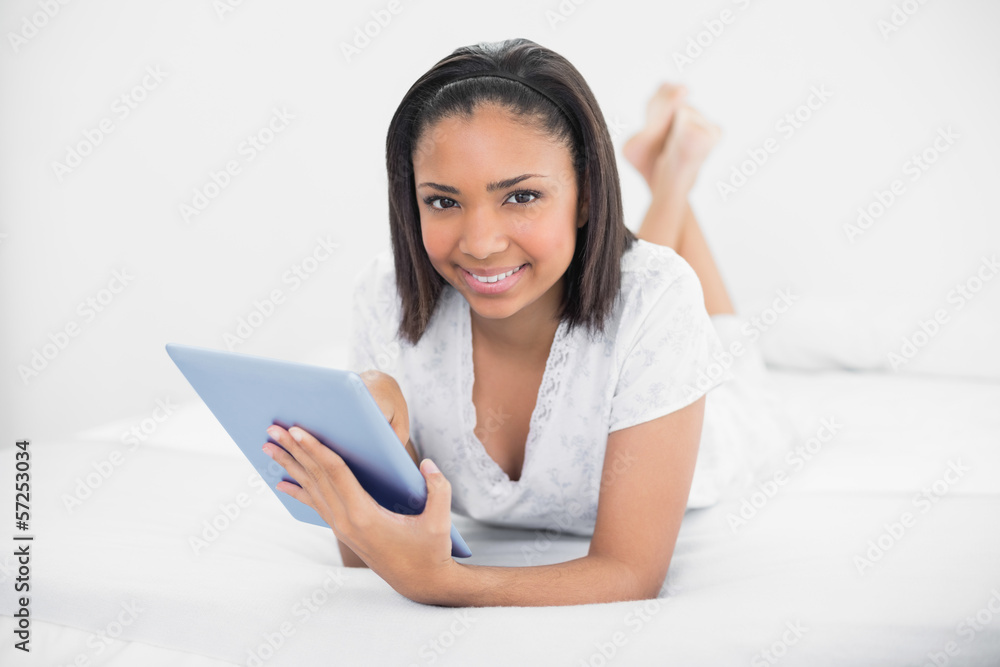 Pretty young dark haired model using a tablet pc Pretty young dark haired model using a tablet pc