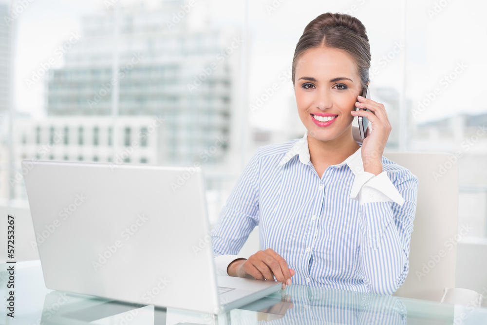 Cheerful businesswoman phoning Cheerful businesswoman phoning
