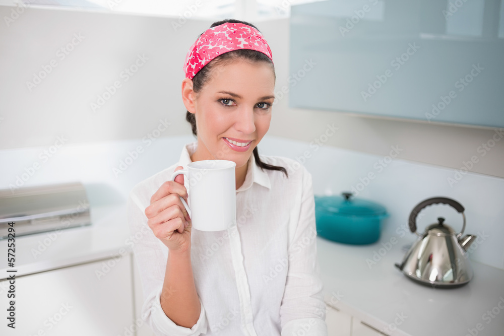Smiling charming woman holding cup of tea Smiling charming woman holding cup of tea