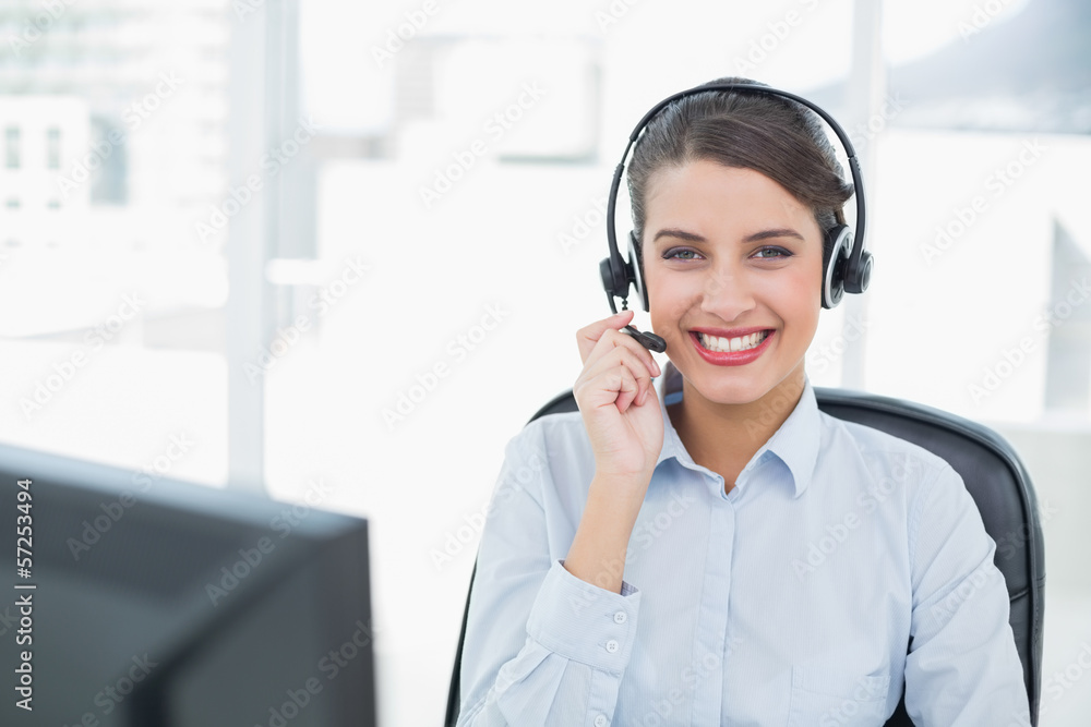 Beautiful classy brown haired operator answering a call Beautiful classy brown haired operator answering a call