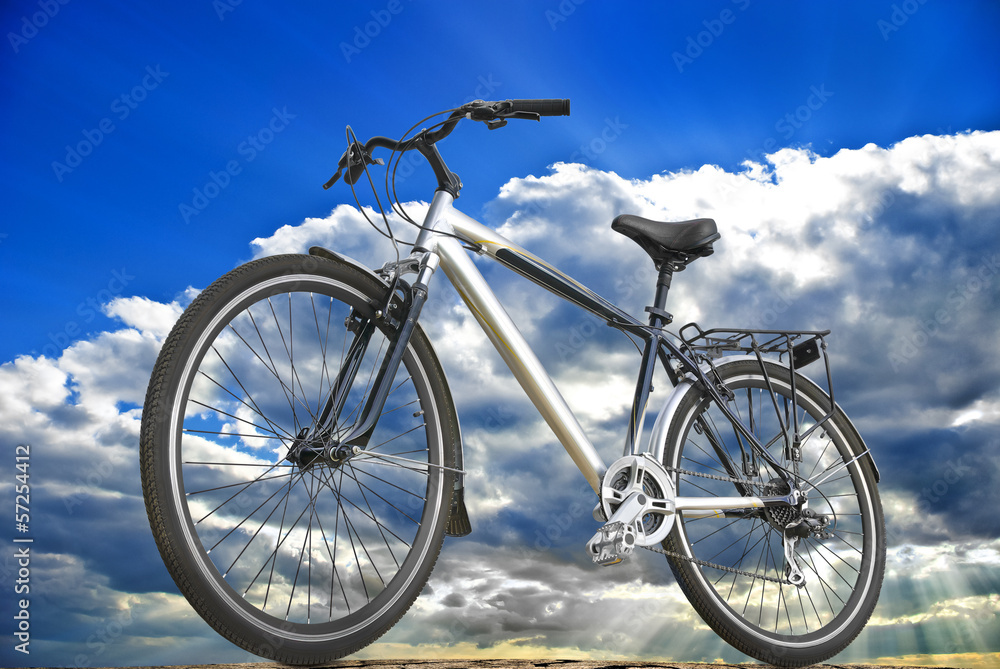 Fototapeta premium Sports bike on the background of sky, clouds and sunlight.