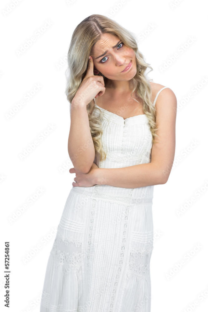 Curly haired blonde having interrogative posture Curly haired blonde having interrogative posture